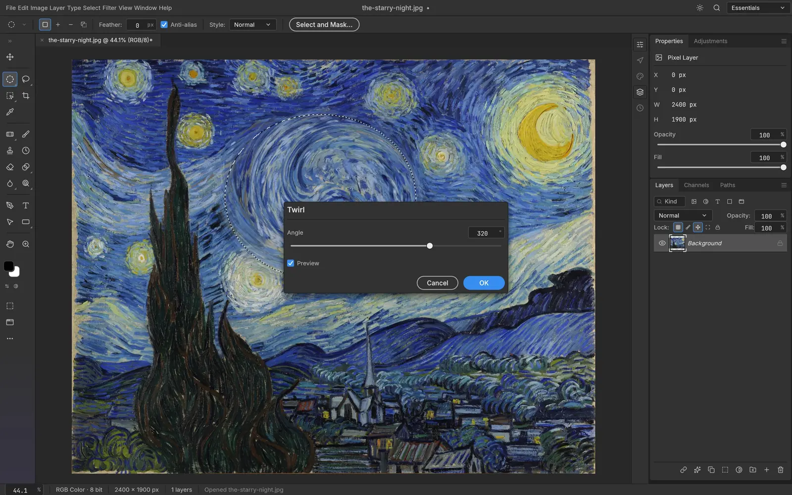 The Twirl filter previewing live inside an elliptical selection on Van Gogh’s The Starry Night